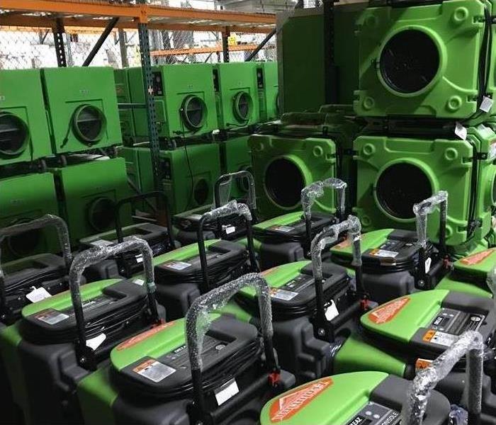 Green drying equipment in warehouse.